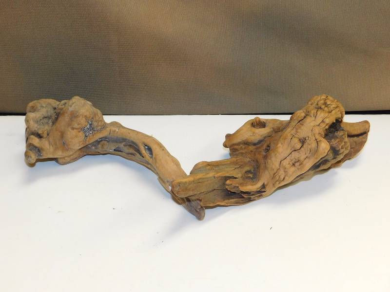 Clear depression glass serving platter and two pieces of decorative driftwood burl root