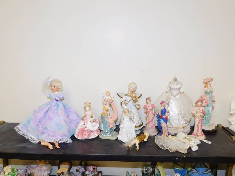 shelf lot of victorian lady figurines and other decor items