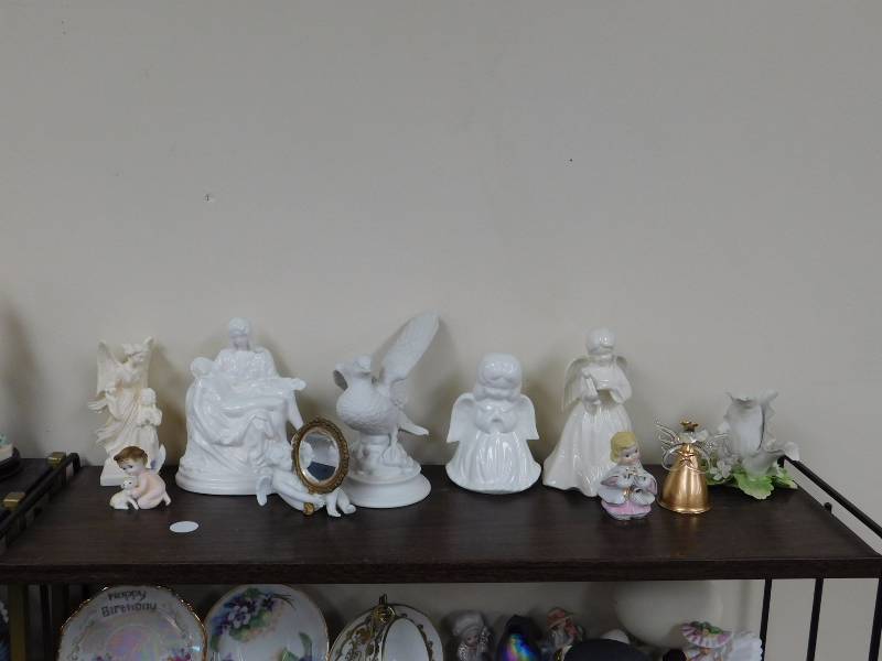 shelf lot of religious figurines