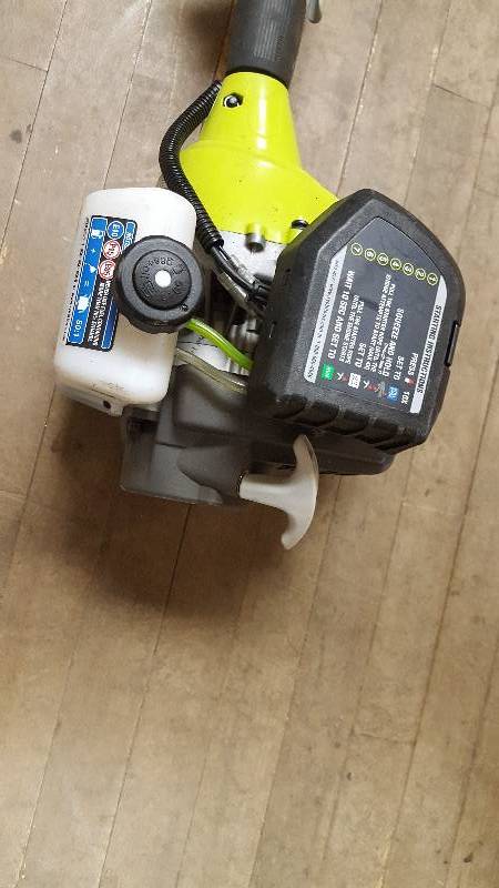 lot 66 image: Ryobi 2 Cycle Trimmer in like New working conditions