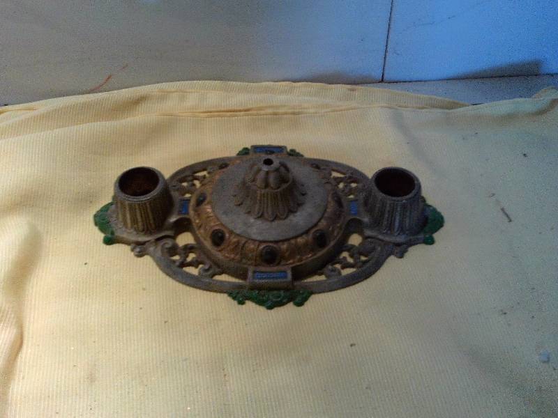 lot 68 image: antique riddle design candle holder