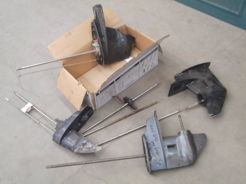 lot 15 image: Box Of Outboard Motor Lower Units &...