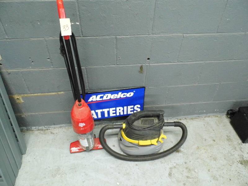 lot 33 image: Vacuums and Sign
