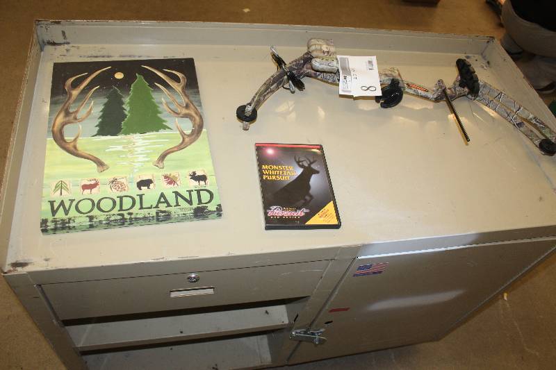 lot 8 image: Lot of (4) Including 1) Desk AND 1) Bear Archery Bow AND 1) DVD Monster Whitetail Pursuit AND 1) Wall Art