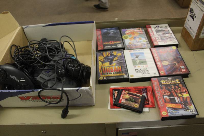 lot 63 image: Box Lot of Sega Genesis Game Console w Controllers, Games