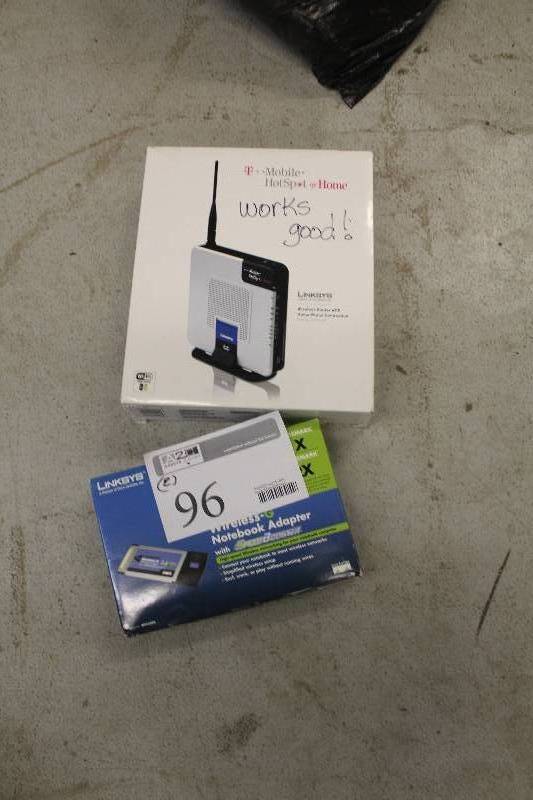 lot 96 image: Lot of (2) Electronics Including 1) T-Mobile HotSpot AND 1) Linksys Wireless-G Notebook Adapter