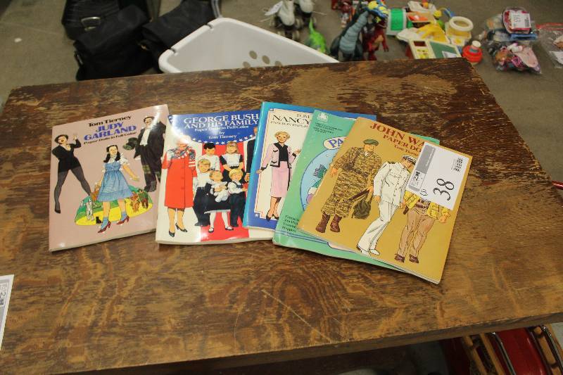 lot 38 image: Lot of (5) Vintage Paper Doll Books Including Judy Garland George Bush And His Family Nancy Reagan John Wayne And More
