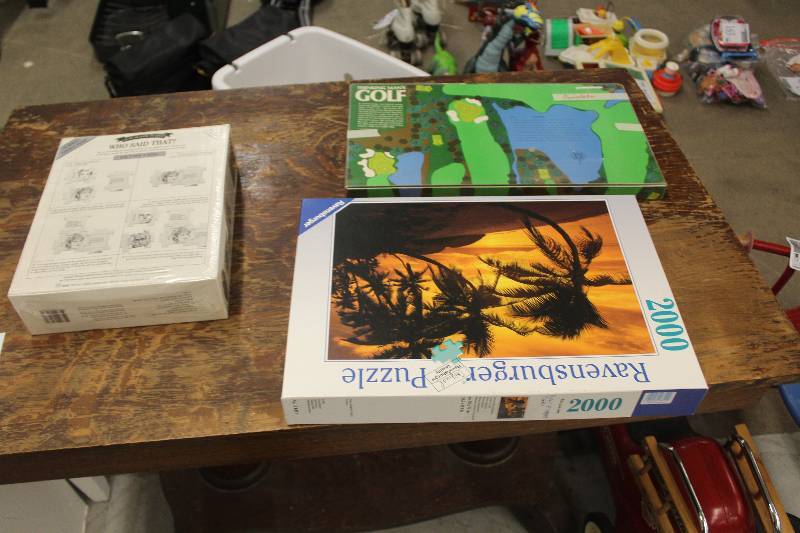 lot 39 image: Lot of (3) Including 1) Ravensburger Puzzle 2000-Pieces AND 1) Thinking Mans Golf Board Game AND 1) Who Said That Jigsaw Puzzle