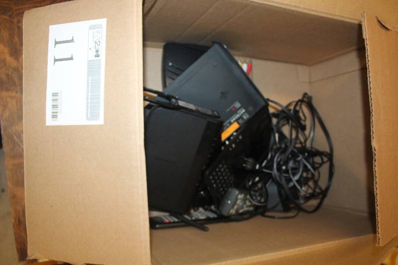 lot 11 image: Box Lot of Electronics Including 1) Netgear Dual Band Wireless-N Gigabit Router AND 1) Netgear 2.4GHz 4-Channel Router AND 1) Belkin AND 1) Linksys