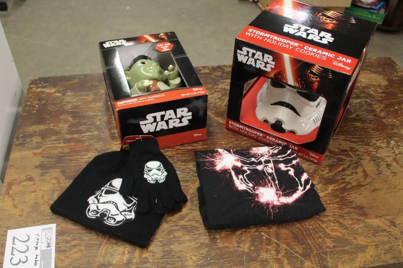 lot 26 image: Lot of (4) Star Wars Memorabilia Including 2) T-shirts AND 1) Yoda Gumball Dispenser w Gumballs AND 1) Stormtrooper Ceramic Jar w Holiday Cookies