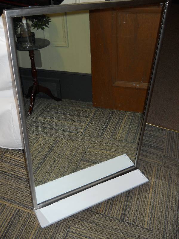 lot 5 image:  BOBRICK Commercial Mirror with Bracket  New  Glass has minor blemish DIMENSIONS 24 x 36