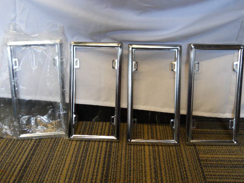 lot 16 image: FOUR (4) Metal License Plate Frames