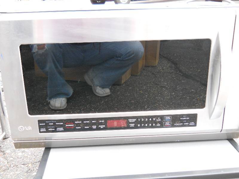 lot 49 image: LG Stainless Steel Microwave  Over the Range  Scratch and Dent  Please inspect Model LMHM2017ST