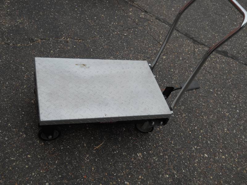 lot 55 image: CHAMPION POWER EQUIPMENT Pneumatic Hydraulic Table Lift, 500 lb capacity  Aluminum Tread Pattern  working condition  foot lever retraction