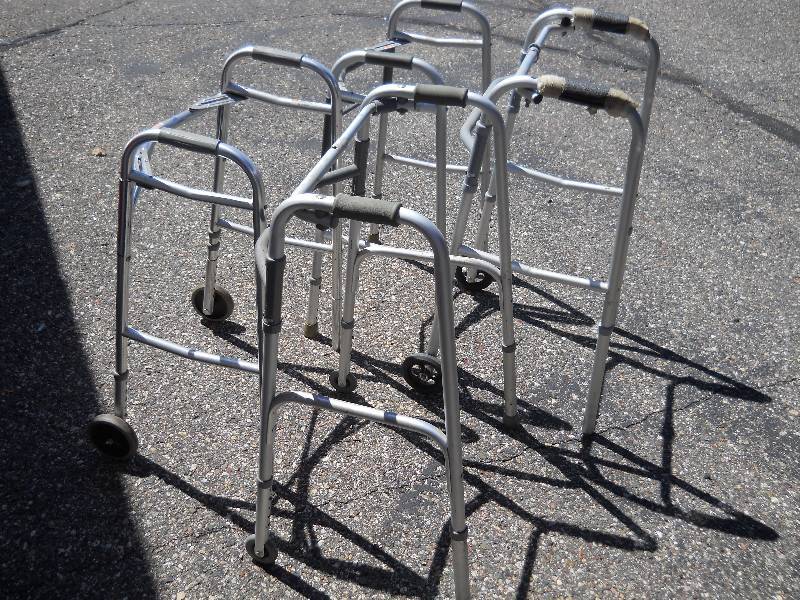 lot 73 image: FOUR (4) Folding Walkers