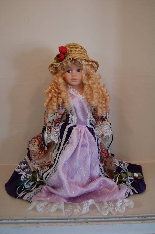 lot 9 image: Porcelain Doll
