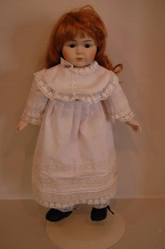 lot 16 image: Porcelain DollMusic Player