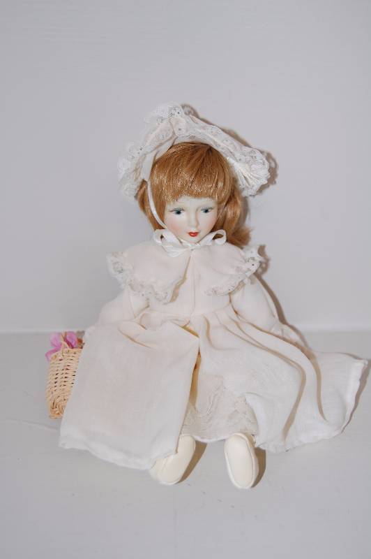 lot 26 image: Porcelain Doll