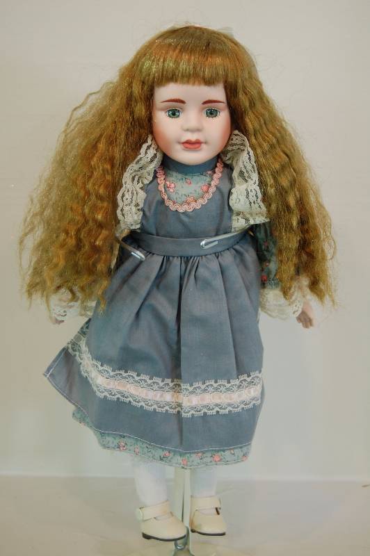 lot 32 image: Porcelain Doll