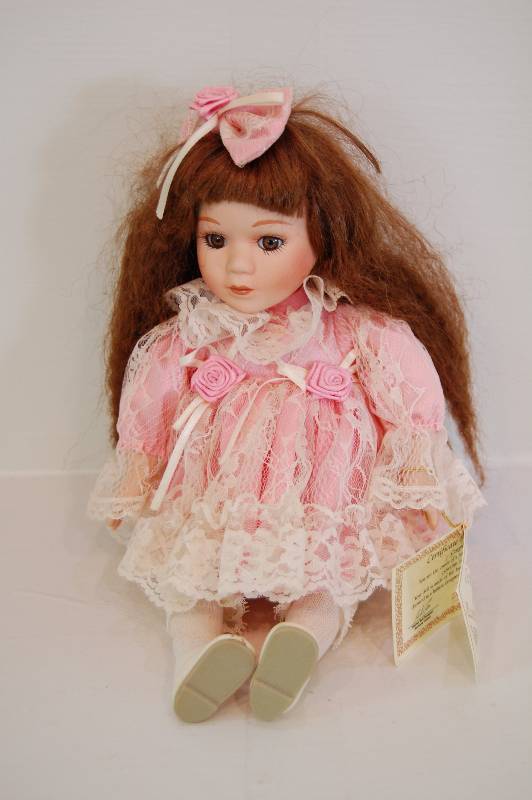 lot 35 image: Porcelain Doll Music Player