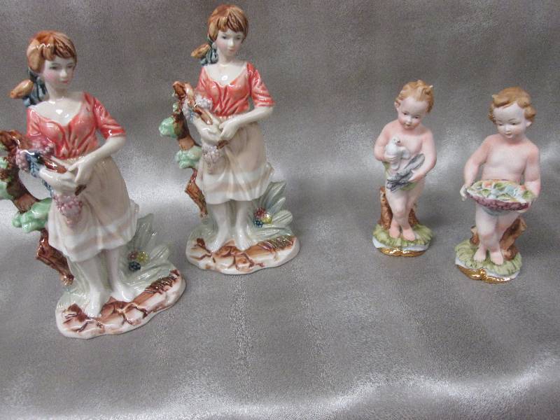 2 pair matching ceramic figurines...