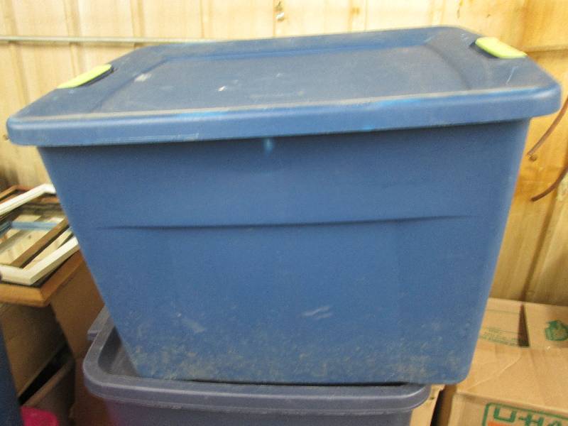 Blue Sterilite plastic tote with ha...