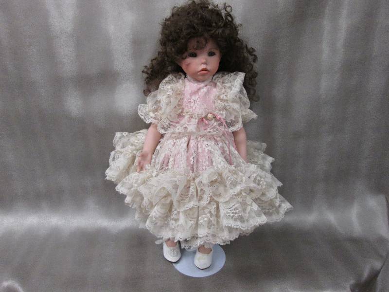 Jointed porcelain 20 doll wearing ...
