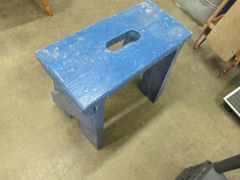 Blue painted wooden stool with hand...