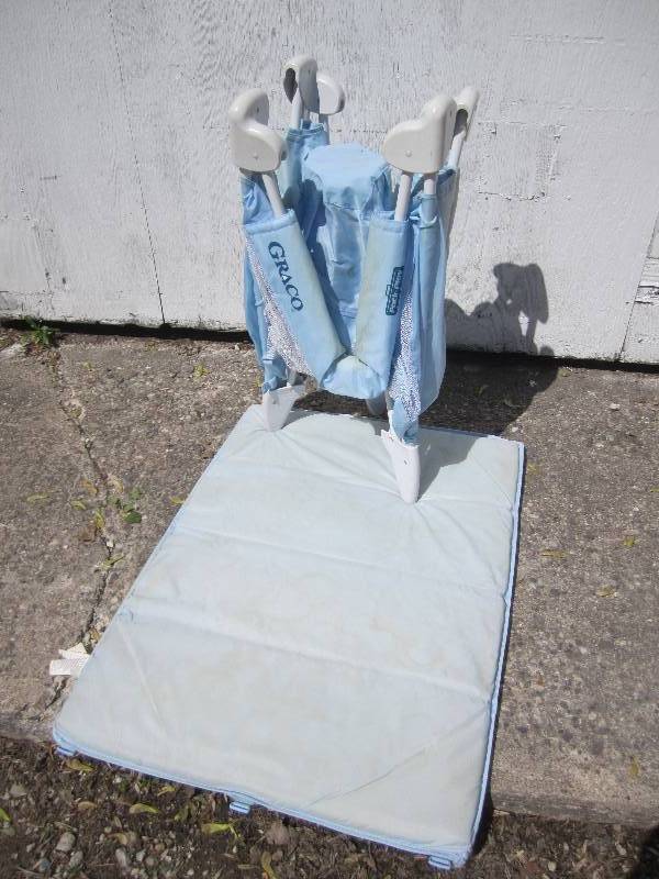 lot 10 image: Graco pack n play folding crib...