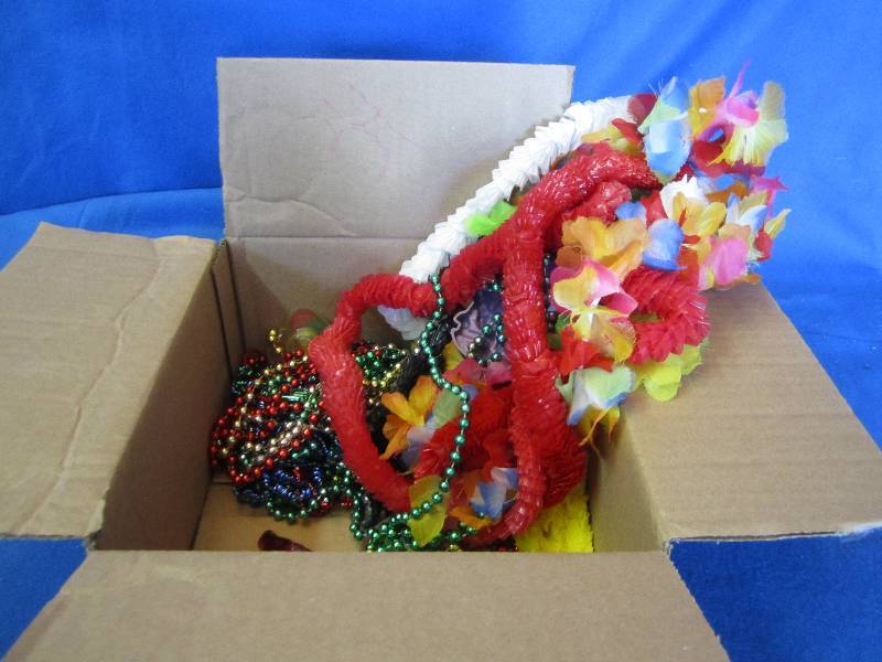 lot 144 image: Lot of leighs and mardi gras beads...