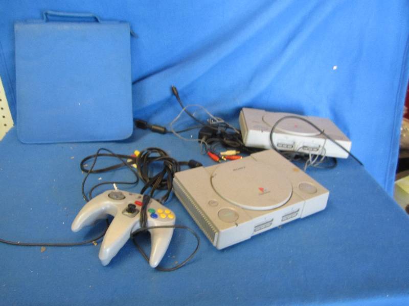 lot 177 image: 2 Sony playstations, games and DVDs...