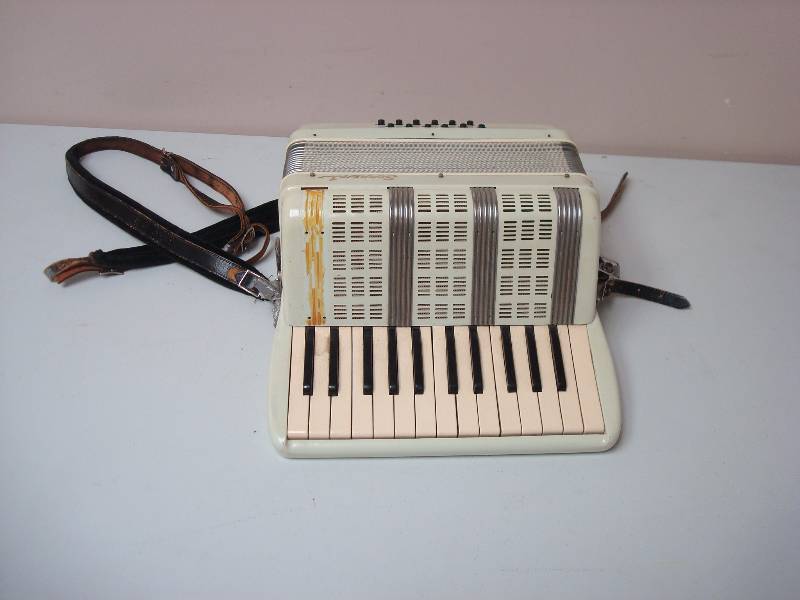 lot 7 image: Small Accordion, Shows Some Wear, Marks, Works, No Buttons Stuck, Something Rattles Inside, I Believe Its A Twelve Chord Sorrento