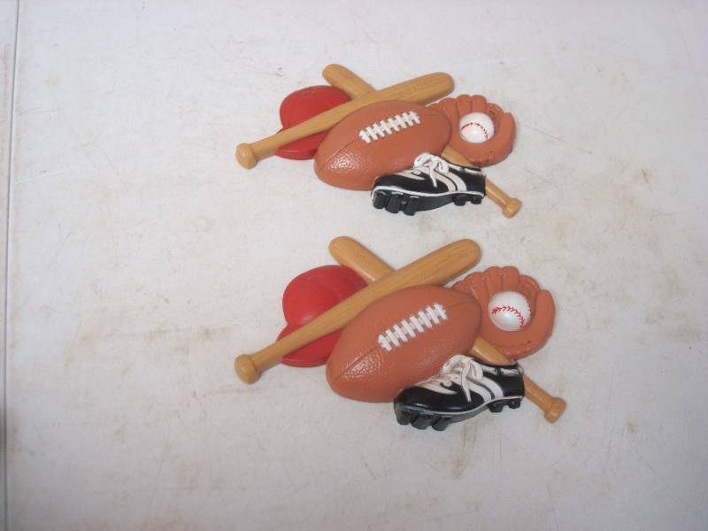 lot 34 image: Pair Of Hanging Plastic Sports Wall Decor