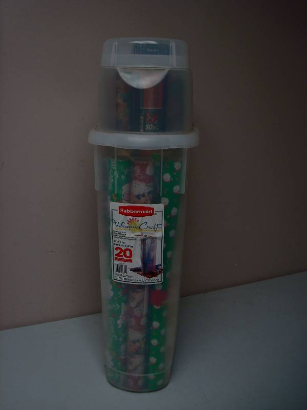 lot 37 image: Storage Bin With Mostly New Christmas Paper Wrap