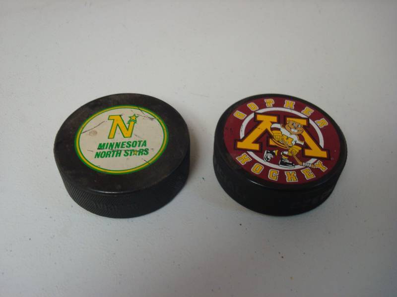 lot 69 image: Minnesota North Stars And Gophers Hockey Pucks