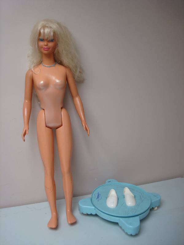 lot 79 image: Large Barbie Doll, Used, Some Marks, Base Is Missing One Wheel