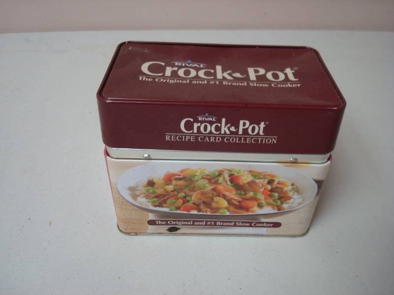 lot 99 image: Crock Pot Tin With Some Recipes 