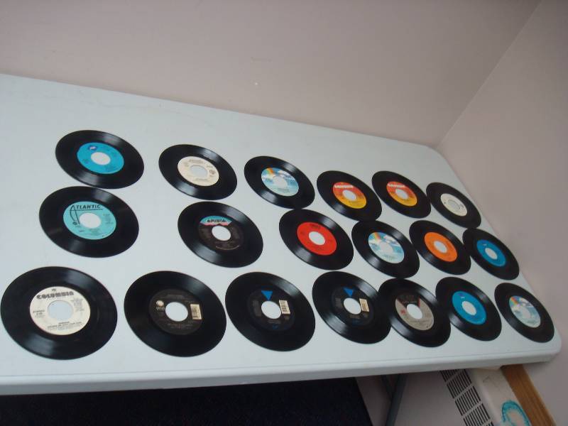 lot 117 image: Lot Of 19 -  7 Vinyl LP 45 Records, Used, Some Show Wear, Guns And Roses, See Pics For Titles
