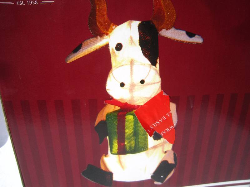 lot 286 image: Iridescent Christmas Cow in Box