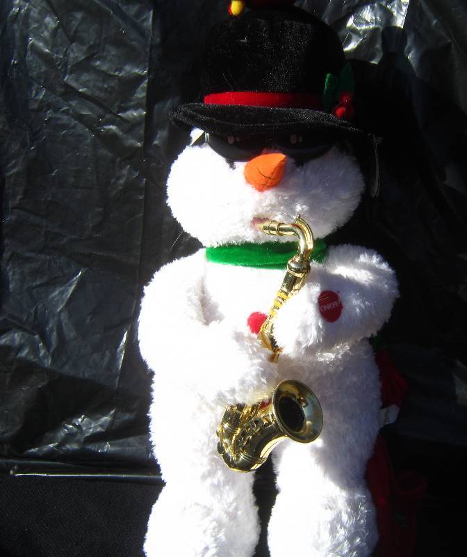 lot 302 image: Snowman playing Saxophone works
