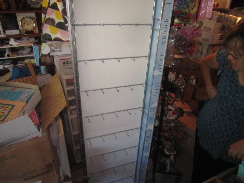 lot 270 image: Ornaments Rack with 4 Sides on Wheels