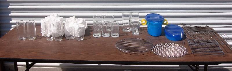 drinking glasses, pasta drainer