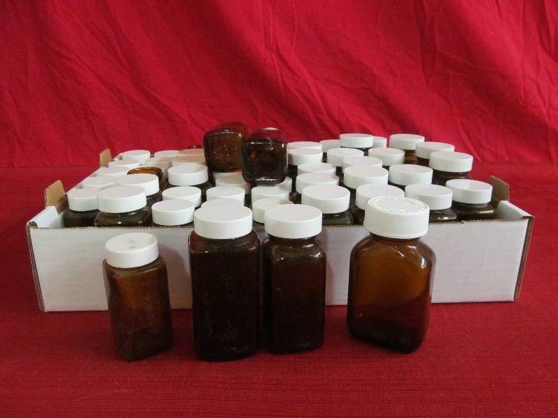 lot 70 image: amber bottles