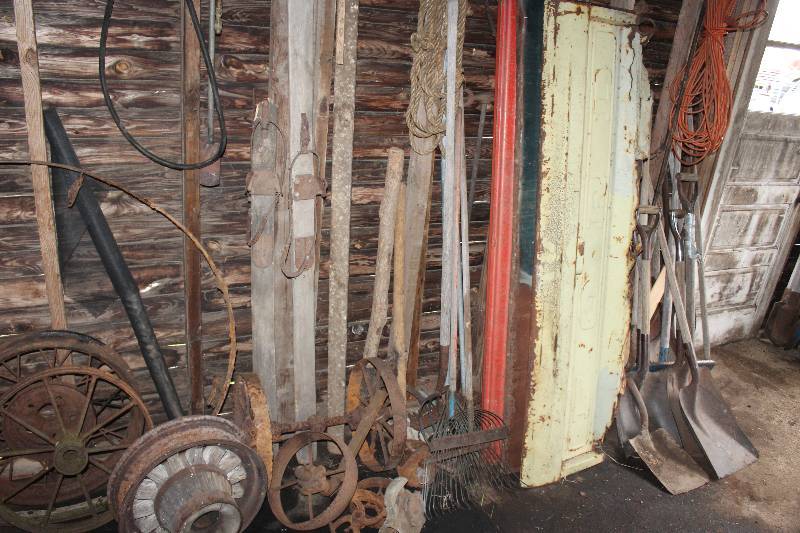 lot 70 image: Contents to Door Including Shovels Metal Wheels Ropes Extension Cords And More
