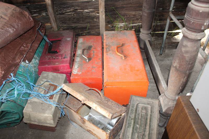 lot 107 image: Under Table Lot of Tool Boxes Tarps Propane Tanks Fuel Tanks AC Unit And More