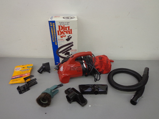 lot 44 image: Hand Held Dirt Devil Ultra, Vacuum Bags & Attachment Kit