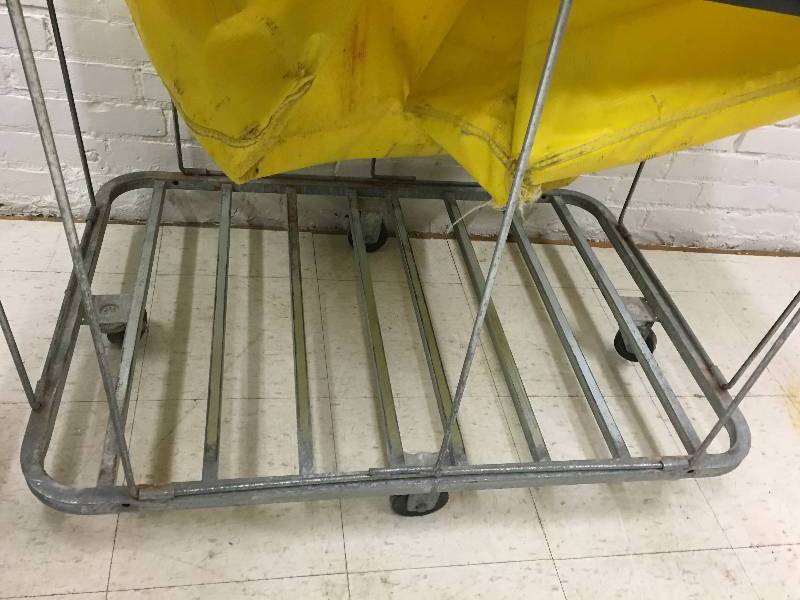 lot 44 image: large rolling laundry cart from a hotel