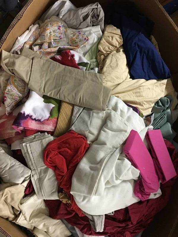 lot 423 image: Large gaylord of new sheets,couch covers and curtains random sizes and colors   name brand items
