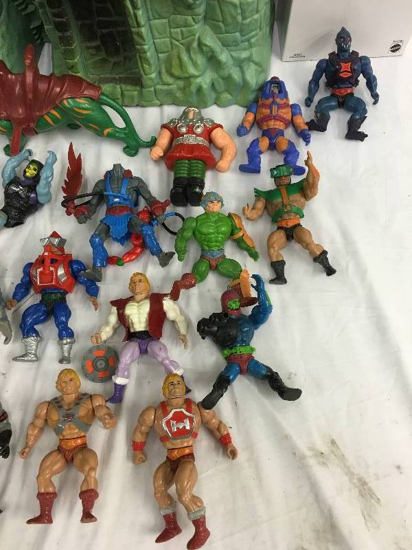 lot 437 image: antique heman toys and castle    new heman roboto toy