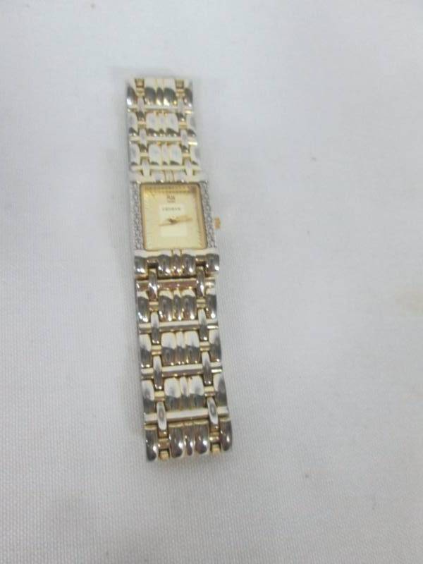 lot 18 image: Geneve Ladies Gold Tone Diamond Watch